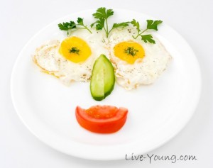 fried eggs with vegetables, served for kids
